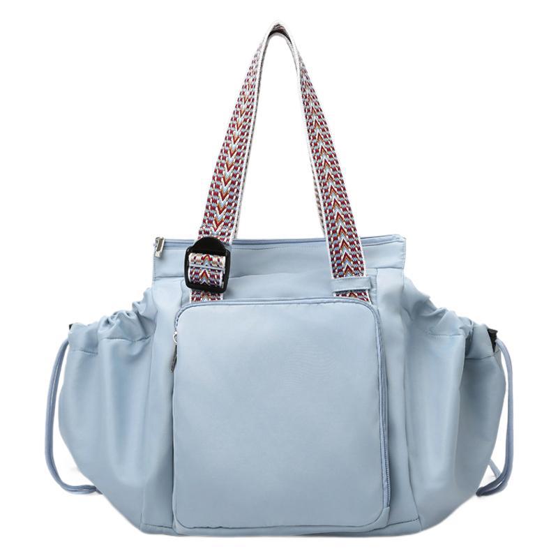 Drawstring Pocket Tote in blue, front view