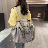 Gray Drawstring Pocket Tote carried on the shoulder