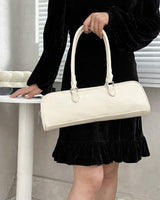 Cream Baguette Bag shown in use