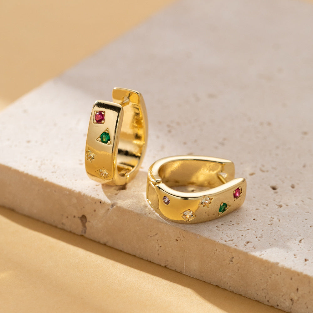 Product photo of the Gold / Rainbow huggie hoop pair