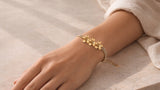 Gold-Tone Flower Bracelet worn on the wrist