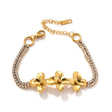 Gold-tone flower bracelet on a white background
