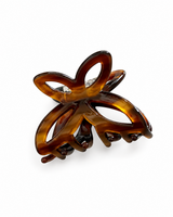 Tortoiseshell butterfly hair claw on a white background