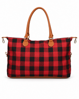 Red buffalo check weekender bag on a white background