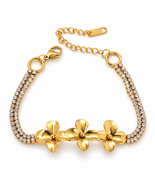Gold-tone flower bracelet on a white background