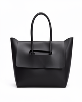 Black structured flap tote on a white background