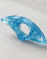 Close-up detail of the blue resin thumb page holder