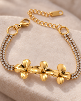 Close-up detail of the gold-tone flower bracelet