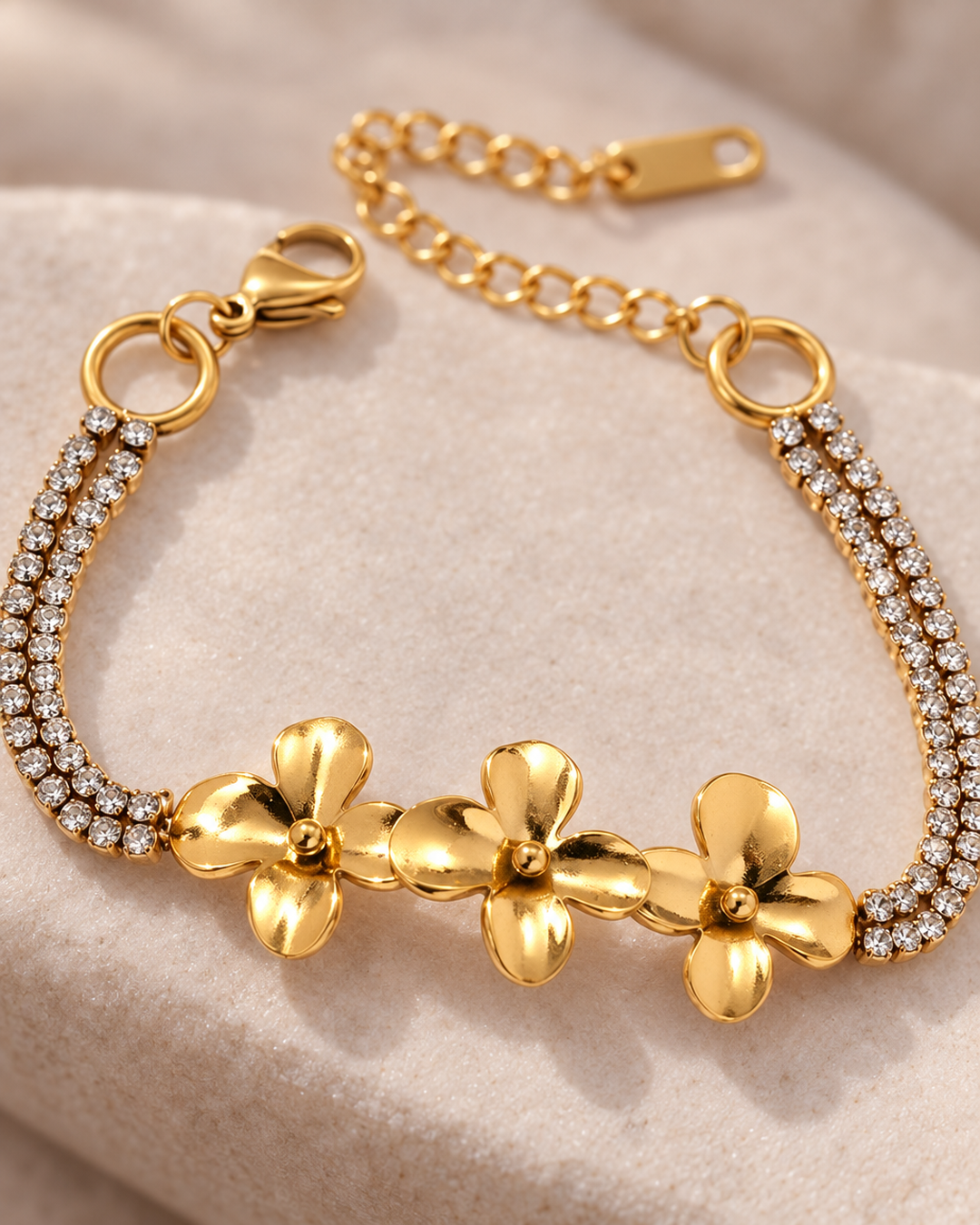Close-up detail of the gold-tone flower bracelet