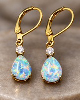Close-up detail of the opal-look teardrop earrings