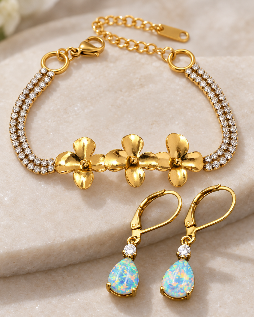 Close-up of the gold-tone flowers and opal-look stones