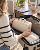 Hanging toiletry bag packed into a carry-on before a trip