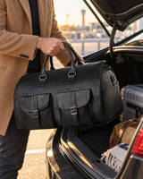 Black folding weekender bag lifted from a car trunk