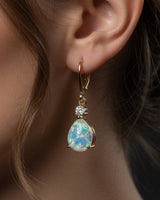 Opal Teardrop Earrings shown in use