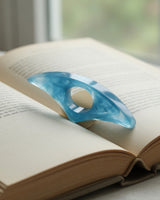 Resin Thumb Bookmark shown in use